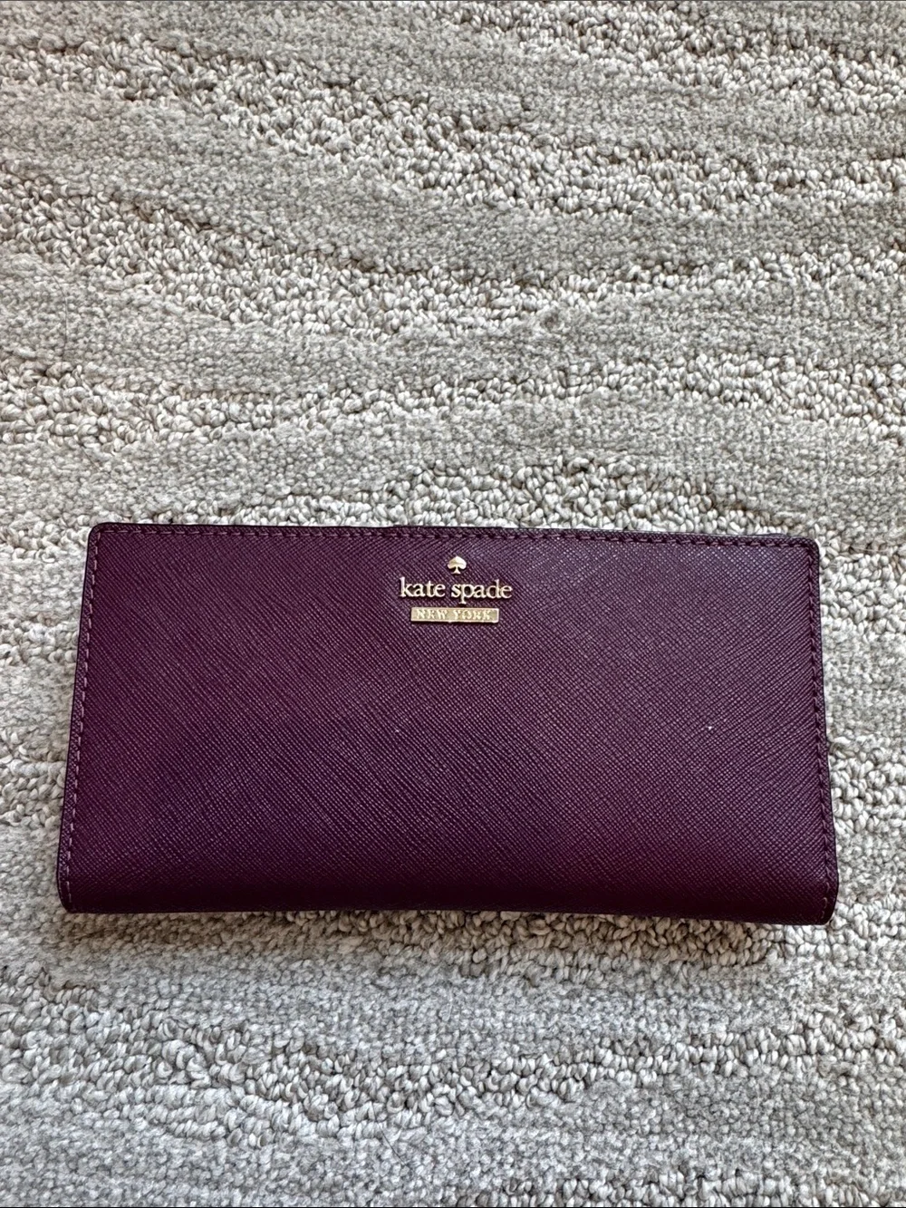 kate spade plum Saffiano continental wallet with gold logo